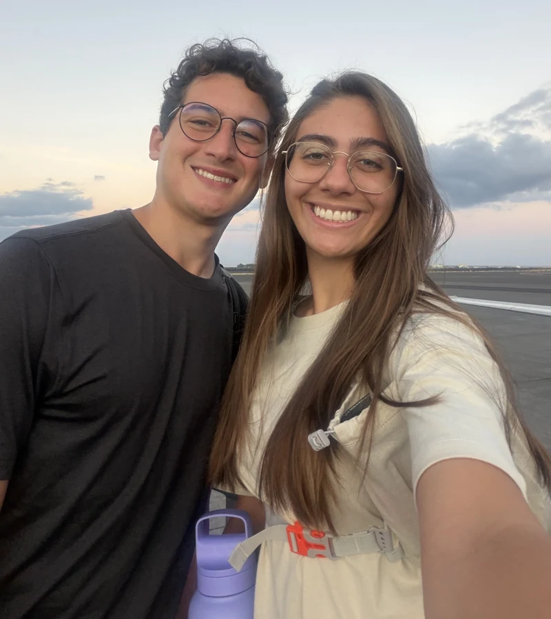 Gabriel and Rebecca smiling together toward the camera.
